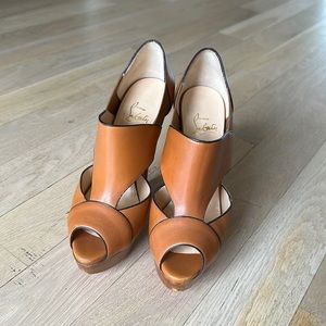 CHRISTIAN LOUBOUTIN
Calfskin Pitou 150 Peep Toe Platform Booties in tan 38.5